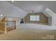 Spacious bonus room with neutral carpet and dormer window at 324 Quinby Way, Rock Hill, SC 29732