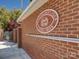 View of the Swim & Racquet Club sign on the exterior of a red brick building at 324 Quinby Way, Rock Hill, SC 29732