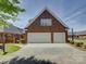 Brick home with a two-car garage and well-maintained landscaping, set under a clear blue sky at 324 Quinby Way, Rock Hill, SC 29732