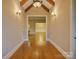 Grand foyer with hardwood floors, exposed beams, and decorative lighting fixtures at 324 Quinby Way, Rock Hill, SC 29732