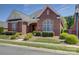 Beautiful brick home featuring manicured landscaping and a stone walkway at 324 Quinby Way, Rock Hill, SC 29732