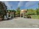 Picturesque gazebo and pergola with lush landscaping, perfect for outdoor events and serene relaxation at 324 Quinby Way, Rock Hill, SC 29732