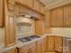 This kitchen features custom cabinets, granite countertops, and a modern gas range at 324 Quinby Way, Rock Hill, SC 29732