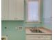 Laundry room featuring stainless sink and cabinets at 324 Quinby Way, Rock Hill, SC 29732