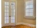 Cozy office with French doors, hardwood floors, and a window with plantation shutters at 324 Quinby Way, Rock Hill, SC 29732