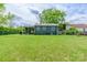 The backyard has a lush lawn enclosed by a chain-link fence, providing a secure area at 400 Rhyne St, Stanley, NC 28164