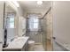 Updated bathroom features modern fixtures, a glass-enclosed shower, and stylish tile work for a sleek look at 400 Rhyne St, Stanley, NC 28164
