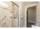 Elegant bathroom featuring a glass-enclosed shower with marble tile, and convenient grab bars for added safety at 400 Rhyne St, Stanley, NC 28164