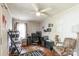 Cozy bedroom features hardwood floors, ceiling fan, and a comfortable seating area, creating a warm and inviting atmosphere at 400 Rhyne St, Stanley, NC 28164