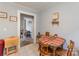 Cozy dining area with tile floors, a wooden table, and a view into an adjacent room at 400 Rhyne St, Stanley, NC 28164