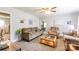 Cozy living room with neutral paint, plush carpeting, comfortable seating, and a ceiling fan at 400 Rhyne St, Stanley, NC 28164