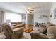 Spacious living room offering comfortable sofas, soft lighting, neutral colors, and a cozy atmosphere at 400 Rhyne St, Stanley, NC 28164