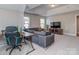 A bonus room includes a comfortable seating area with a desk and a TV area, perfect for relaxing and entertaining at 4008 Widgeon Way, Waxhaw, NC 28173