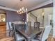 Elegant dining room featuring a dark wood table, ornate chairs, and a stylish chandelier at 4008 Widgeon Way, Waxhaw, NC 28173