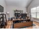 Modern home office setup with dual monitors, a spacious desk, and a cozy blue rug at 4008 Widgeon Way, Waxhaw, NC 28173