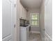 Bright laundry room with built in white cabinetry and a window for lots of natural light at 4008 Widgeon Way, Waxhaw, NC 28173