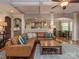 Open-concept living room featuring a cozy seating area and seamless access to the kitchen and dining spaces at 4008 Widgeon Way, Waxhaw, NC 28173