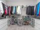Large walk-in closet with installed shelving, closet rods, and drawer units for maximum storage at 4008 Widgeon Way, Waxhaw, NC 28173