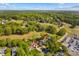 Stunning aerial view of a home on a golf course with lush green surroundings at 422 Wildwood Dr, Salisbury, NC 28146