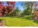 Well-maintained backyard with verdant lawn and beautiful landscaping features at 422 Wildwood Dr, Salisbury, NC 28146