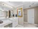 A bathroom with a white vanity and framed artwork above the toilet at 422 Wildwood Dr, Salisbury, NC 28146