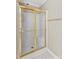 Bathroom shower with a gold frame and glass doors at 422 Wildwood Dr, Salisbury, NC 28146