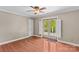 Bedroom with hardwood floors, neutral walls, and a door leading to a deck at 422 Wildwood Dr, Salisbury, NC 28146