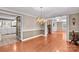 Dining room with hardwood floors, chandelier, and open access to other rooms at 422 Wildwood Dr, Salisbury, NC 28146