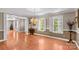 Dining room features hardwood floors, a chandelier, and multiple windows with shutters at 422 Wildwood Dr, Salisbury, NC 28146