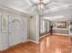 Welcoming entryway with hardwood floors, crown molding, and a view into the adjacent living area at 422 Wildwood Dr, Salisbury, NC 28146