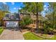 Charming brick home with mature landscaping, an attached garage, and a welcoming front porch at 422 Wildwood Dr, Salisbury, NC 28146