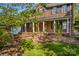 Inviting brick home with a covered porch, classic shutters, and well-maintained landscaping at 422 Wildwood Dr, Salisbury, NC 28146