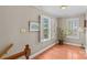 Hallway area featuring hardwood floors, natural light, and neutral colored walls at 422 Wildwood Dr, Salisbury, NC 28146
