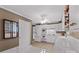 Kitchen features white cabinetry, appliances, tile countertops, wine rack, and tile flooring at 422 Wildwood Dr, Salisbury, NC 28146