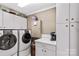 Laundry room with white cabinetry, washer, dryer, and countertop at 422 Wildwood Dr, Salisbury, NC 28146