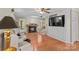 Bright living room with fireplace, built-in entertainment center, and staircase at 422 Wildwood Dr, Salisbury, NC 28146