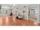 Well-lit living room with wood floors and access to kitchen at 422 Wildwood Dr, Salisbury, NC 28146