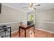 Office with hardwood floors, neutral walls, white trim, and a wood desk at 422 Wildwood Dr, Salisbury, NC 28146