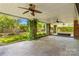 Stamped concrete patio with ceiling fans and decorative brick columns at 422 Wildwood Dr, Salisbury, NC 28146
