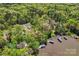 Stunning aerial view of lakefront homes surrounded by lush greenery, perfect for nature lovers seeking tranquility at 531 Hattaway Dr, Mount Gilead, NC 27306