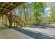 View of the backyard from underneath the deck with a stairway at 531 Hattaway Dr, Mount Gilead, NC 27306