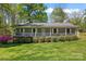Charming single story home featuring a lovely front porch, well-manicured lawn and tasteful landscaping at 531 Hattaway Dr, Mount Gilead, NC 27306