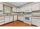 Bright kitchen featuring white cabinetry, granite countertops, and modern appliances at 531 Hattaway Dr, Mount Gilead, NC 27306