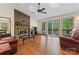 Living room with vaulted ceilings, brick fireplace, skylights and sliding glass doors at 531 Hattaway Dr, Mount Gilead, NC 27306