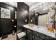 Stylish bathroom featuring black walls, unique light fixtures, and modern fixtures at 5310 Glenlea Walk Ln, Charlotte, NC 28216