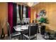 Dining room includes a sleek black dining set, stylish decor, and floor-to-ceiling windows with decorative curtains at 5310 Glenlea Walk Ln, Charlotte, NC 28216