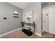 Inviting hallway with modern decor, art piece, stylish shelving, and trendy decorative table at 5310 Glenlea Walk Ln, Charlotte, NC 28216