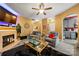 The living room showcases warm walls, a cozy fireplace, and luxury vinyl flooring at 5310 Glenlea Walk Ln, Charlotte, NC 28216