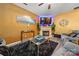 Warm and inviting living room is furnished with a fireplace, TV, and luxury vinyl flooring at 5310 Glenlea Walk Ln, Charlotte, NC 28216