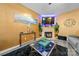 Open-concept living room boasts neutral walls, a sleek fireplace with a TV, and luxury vinyl flooring at 5310 Glenlea Walk Ln, Charlotte, NC 28216